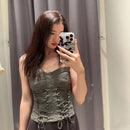 New Women's Spicy Girl Tie Up Tight Fitting Sleeveless Camisole in grey green worn by a model in a mirror.