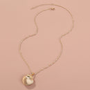 A Copper Shell Necklace That Opens