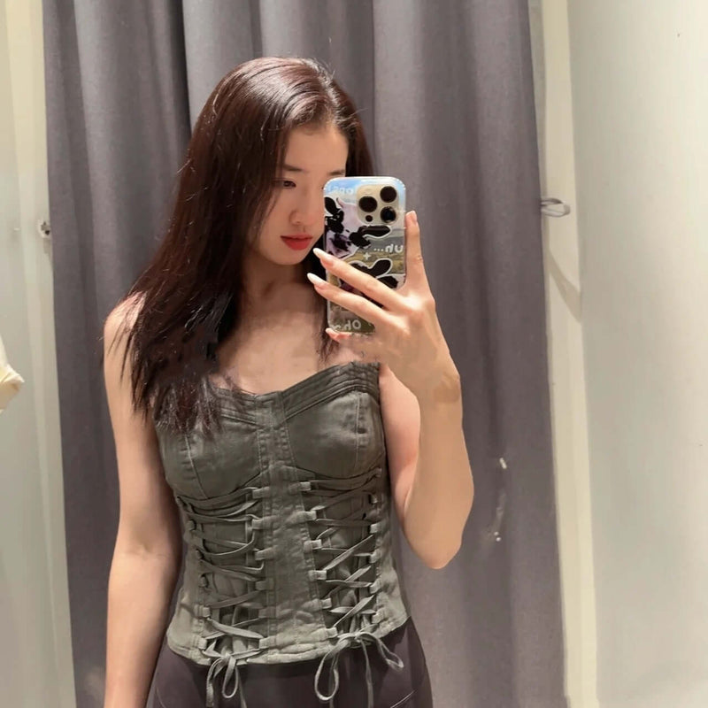 New Women's Spicy Girl Tie Up Tight Fitting Sleeveless Camisole in grey green worn by a model in a mirror.